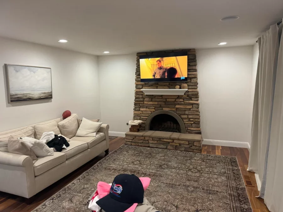 Fireplace demolition and the installation of custom cabinetry and shelving in its place