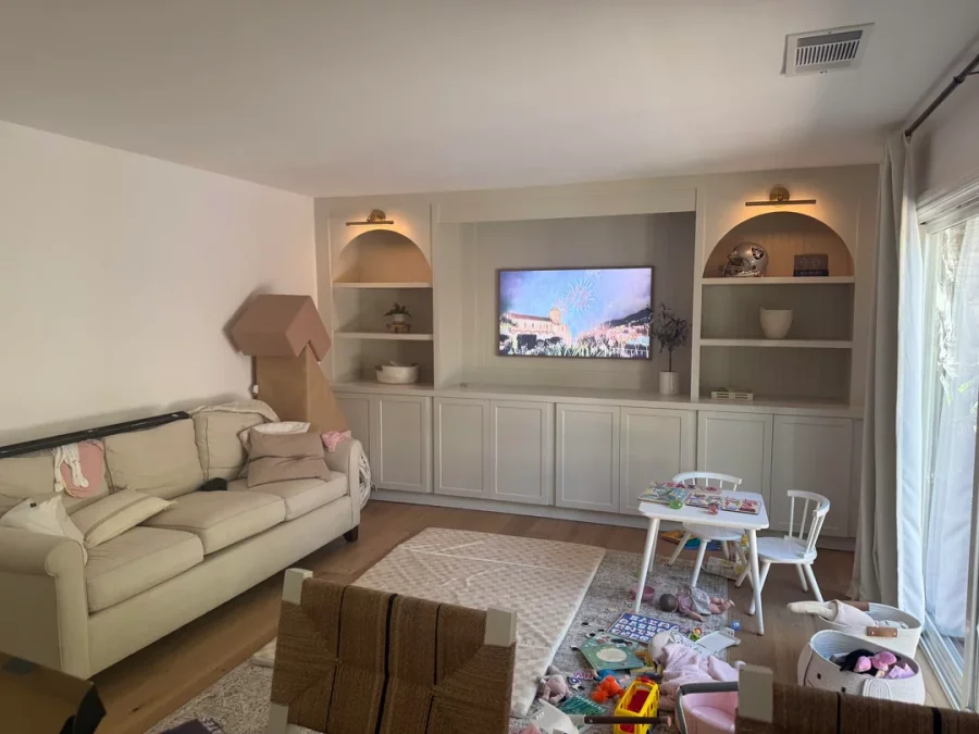Fireplace demolition and the installation of custom cabinetry and shelving in its place