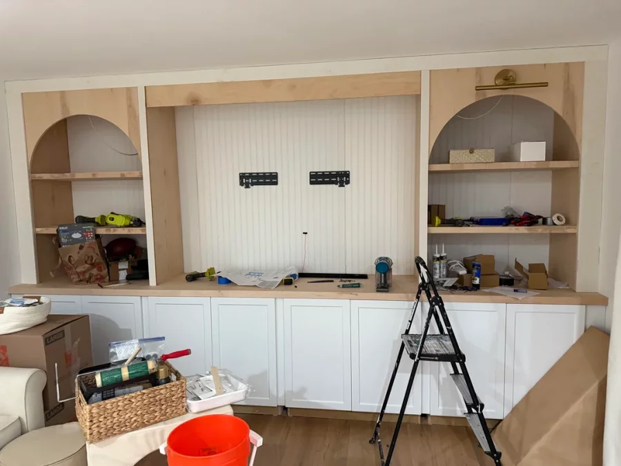 Fireplace demolition and the installation of custom cabinetry and shelving in its place