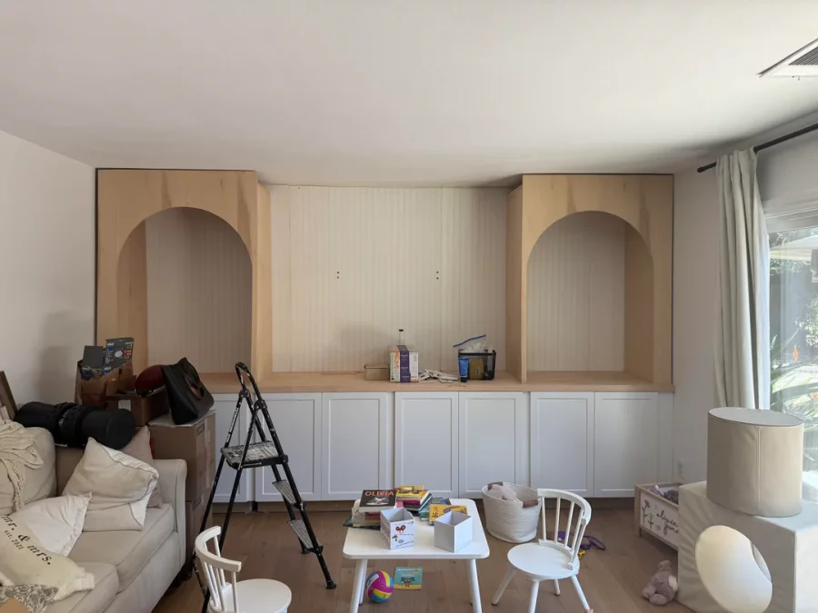 Fireplace demolition and the installation of custom cabinetry and shelving in its place
