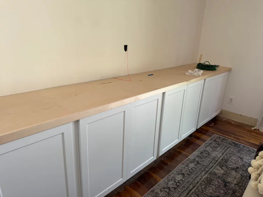 Fireplace demolition and the installation of custom cabinetry and shelving in its place