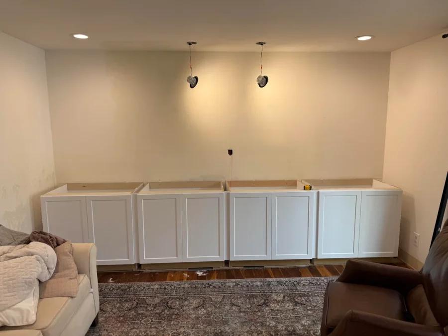 Fireplace demolition and the installation of custom cabinetry and shelving in its place