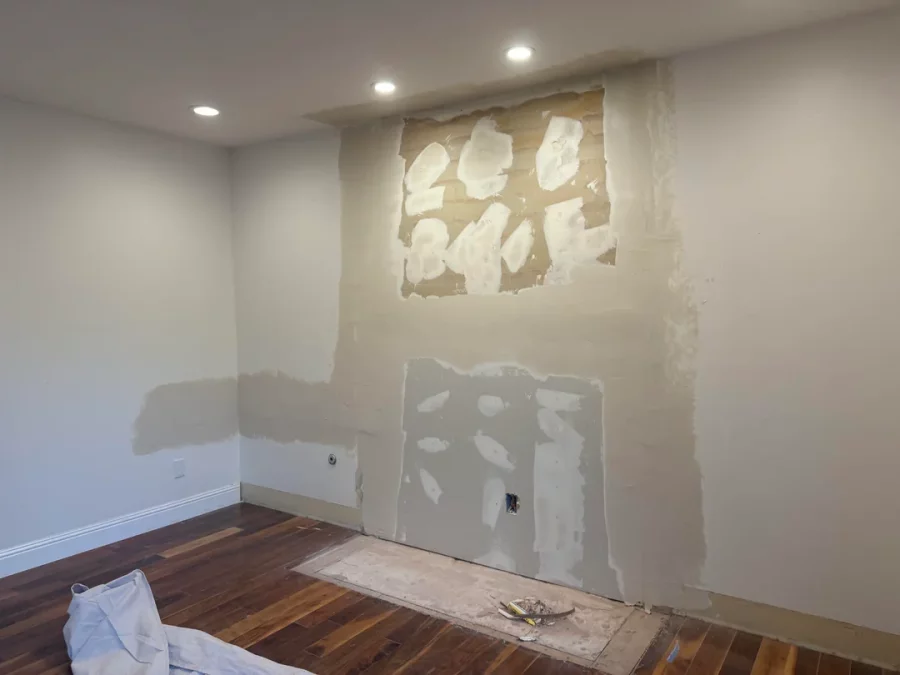 Fireplace demolition and the installation of custom cabinetry and shelving in its place