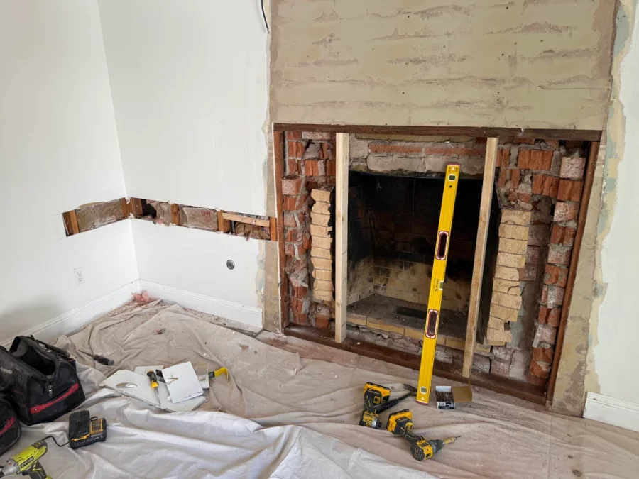 Fireplace demolition and the installation of custom cabinetry and shelving in its place