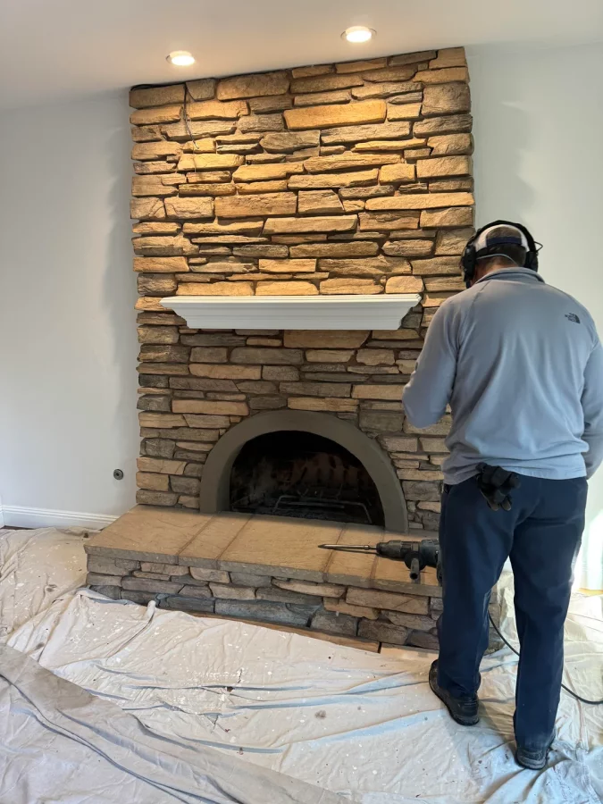 Fireplace demolition and the installation of custom cabinetry and shelving in its place